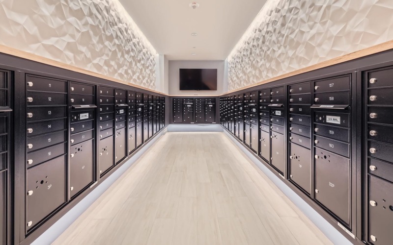 a spacious room with mail receptacles and package lockers