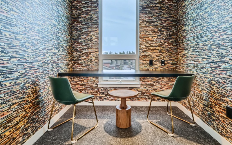 a private study/coworking room with a window