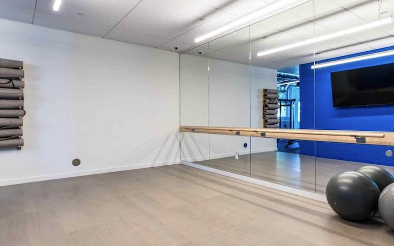 A spacious studio with mats and medicine balls